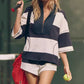 Gestreepte tweedelige set voor dames: top met halve rits en shorts