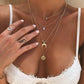Elegante meerlaagse ketting met een sierlijke hanger