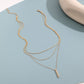 Elegante meerlaagse ketting met een sierlijke hanger